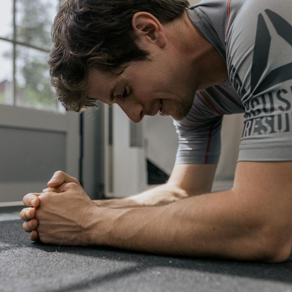 A person in a strong plank pose, demonstrating core strength.